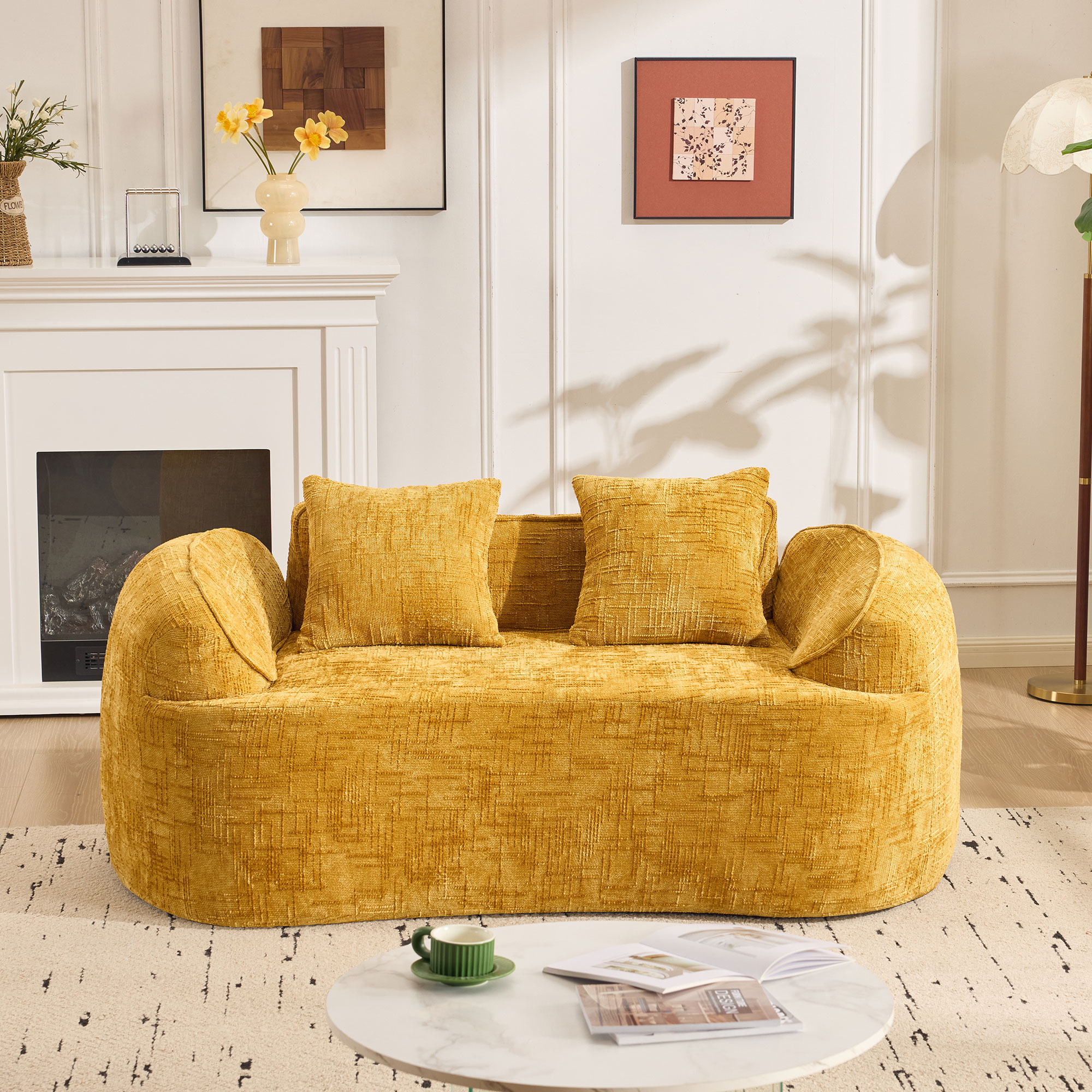 Yellow curved two - person compress  sofa. It has armrests on both sides, comes with two pillows, is suitable for small - sized apartments, and can be placed in the living room or bedroom.